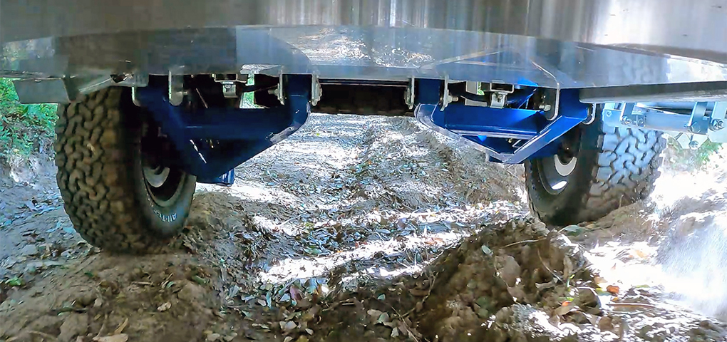 Off-road caravan suspension system in action on a dirt track | Kimberley Kampers Australia