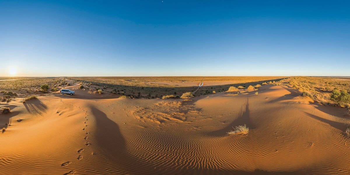 Kimberley Kampers off-road camper on the Birdsville Track in Queensland, surrounded by arid desert landscape.