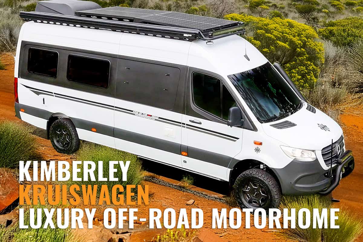 A Kimberley Kruiswagen off-road motorhome parked on a grassy terrain with trees and a clear blue sky in the background, showcasing its rugged yet modern design.