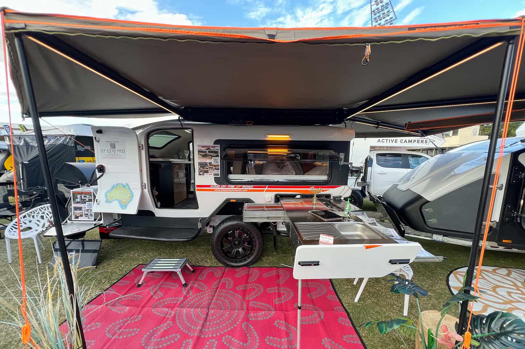 Kimberley Kampers Kube teardrop camper with Darche awning extended, showcasing a compact outdoor setup.
