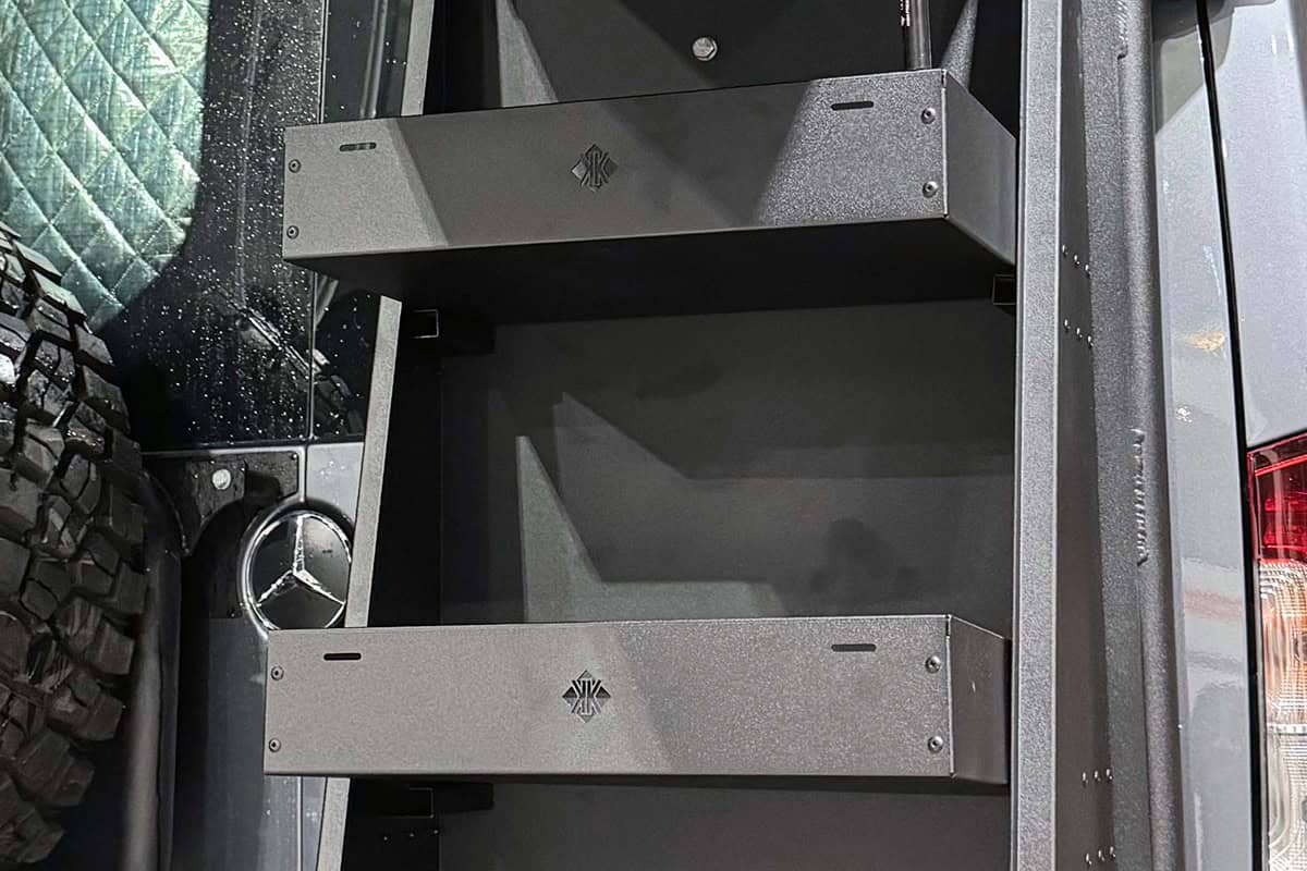 Australian offroad motorhome storage box with gullwing design, featuring internal shelves for organized storage during rugged outdoor adventures.