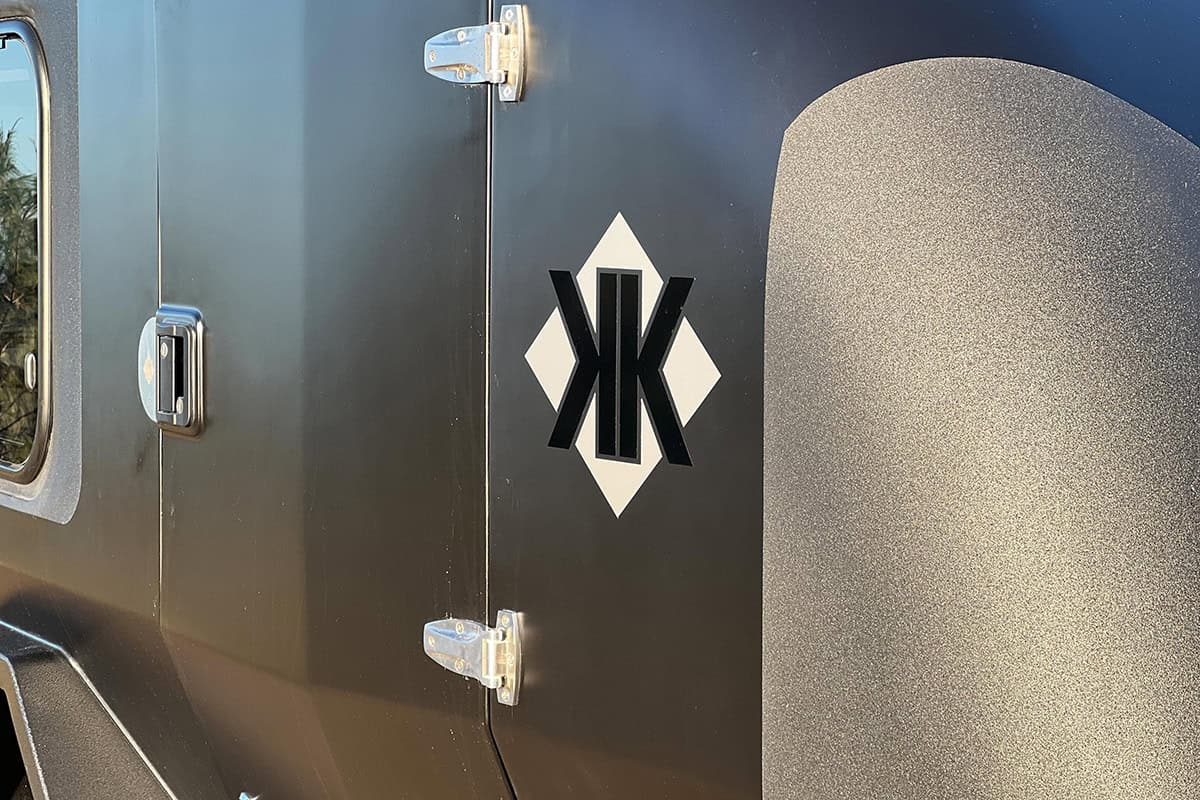 Australian Kube off-road teardrop camper in Night Storm colour upgrade, illuminated by the late afternoon sun.