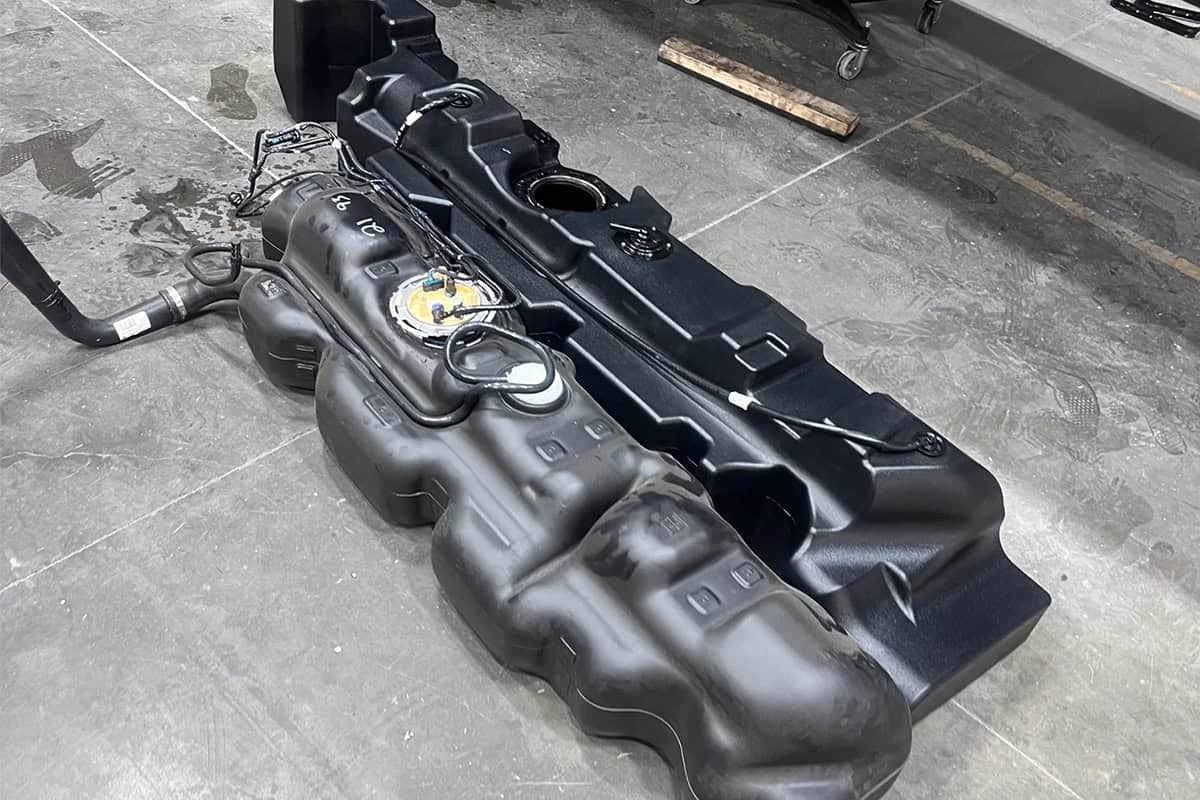 The factory 93L beside the 151L Long Range Fuel Tank for Mercedes Sprinter-Based Kimberley Kampers Kruiswagen Motorhome.